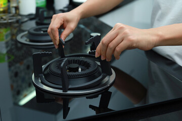 Morden gas stove being installed in the kitchen on the countertop.