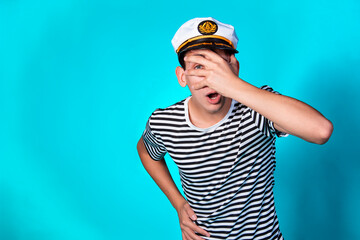 Handsome guy on a black background. Captain of a sea vessel. Positive and negative emotions.