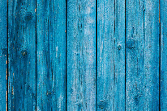 Weathered blue wooden background texture. Shabby blue painted wood.