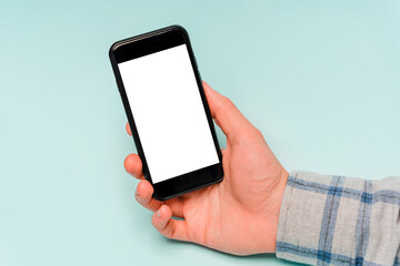 Hands use mobile phone, copy space, blue background