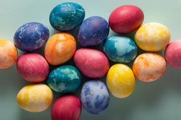 Fototapeta na wymiar Multicolored Easter eggs on a blue background, top view
