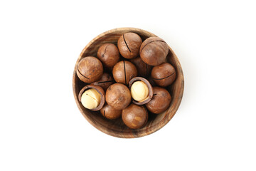 Bowl with macadamia nuts isolated on white background