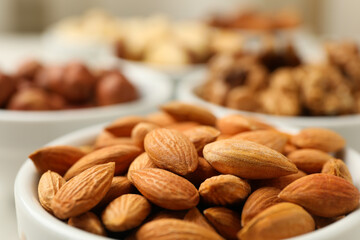 Bowls with different nuts, space for text and close up