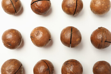 Flat lay with tasty macadamia nuts on white background