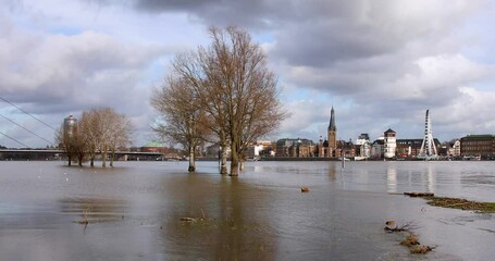 Flood on the Rhine in Dusseldorf on the Oberkasseler meadows, view of the old town