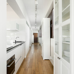 Kitchen in long apartment corridor