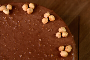 Hazelnut chocolate cake macro of hazelnut on wooden table