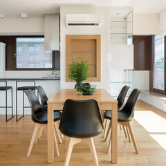 Wooden dining table with black chairs