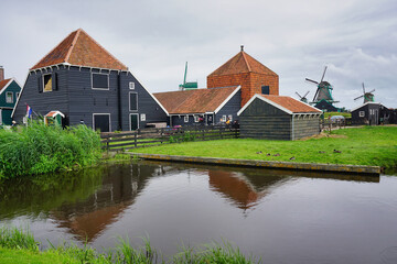 Obraz premium Windmill and traditional village