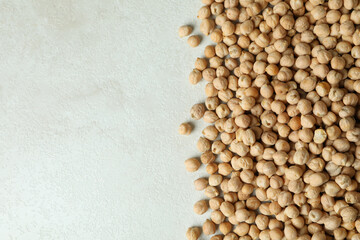 Fresh chickpea on white textured background, space for text