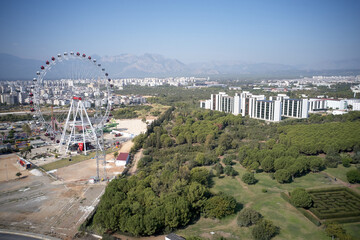 Fototapeta premium Landscape of Antalya with view of Ferris wheel. Travel to Turkey.