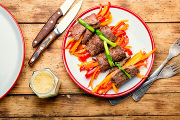 Meat rolls and vegetables on plate