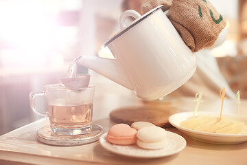 English tea in a cafe / cup and kettle with five o'clock tea