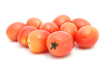 Pile of Tomato isolated on a white background. Thai people call ''Srida Pink Egg Tomato''.