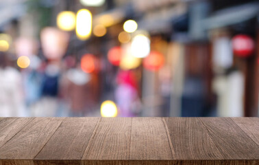 Empty wooden table in front of abstract blurred background of coffee shop . can be used for display or montage your products.Mock up for display of product
