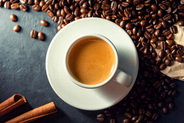 Espresso coffee With coffee beans in the morning background.