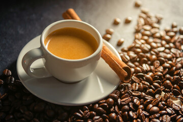 Espresso coffee With coffee beans in the morning background.