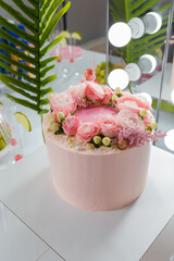 Beautiful pink cake with rose flowers. Birthday party, anniversary celebration or festive event.