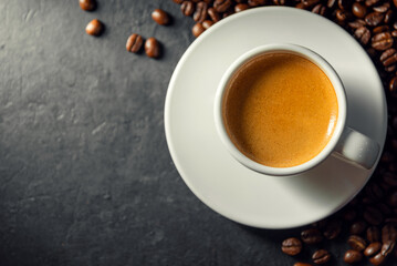 Espresso coffee With coffee beans in the morning background.