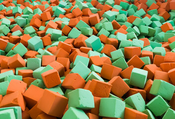 Fototapeta premium Background with bright red and green soft blocks or cubes. Multicolored geometric background.