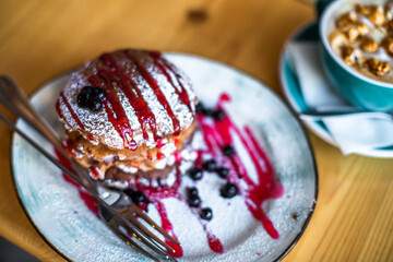 Sugar dessert pan cakes with berries and jam. Breakfast  concept