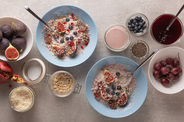 Healthy breakfast with oatmeal and fruit, top view