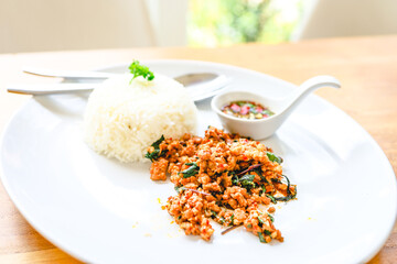 Thai food stir-fried with minced pork and chili pepper and sweet basil