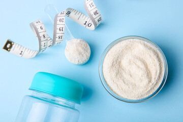 White protein powder and measuring tape