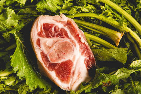 piece of salted pork shoulder on fresh turnip greens, ingredients of the Galician