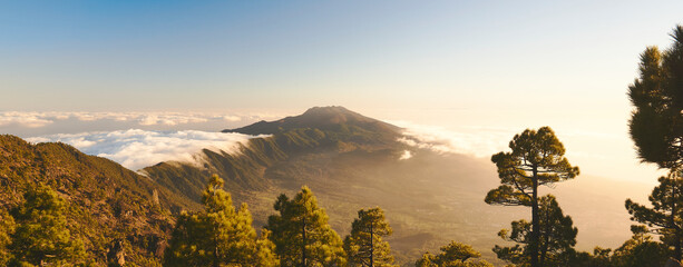 wide panorama of la Palma, Canary Islands with cloud inversion nearing sunset