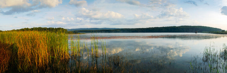 colorful panorama of autumn lake on a bright sunny day