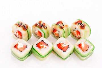 Roll green dragon. Roll with avocado and salmon isolated on white background. Close-up