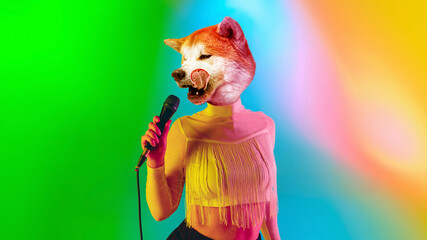 Celebrity. Talented dog, professional musician performing on multicoloted background in neon light. Concept of music, hobby, festival, contemporary art collage. Modern design. Copyspace.