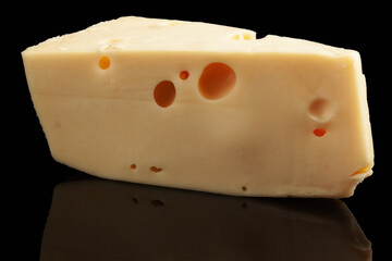 A piece of cheese on a black background - Powered by Adobe