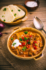 Hungarian Szegedin Goulash with pickled white cabbage (sauerkraut) and bread dumplings