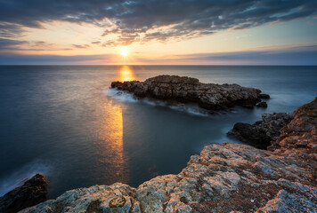 Amazing view with colorful sunrise sky at the rocky coastline of the Black Sea