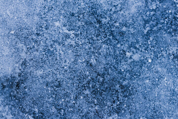 Fototapeta na wymiar Beautiful texture of frozen ice with snow in winter close-up for background and wallpaper