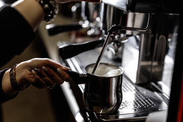 Fototapeta na wymiar Close-up of professional coffee machine. Pouring espresso. Barista preparing deliciouse fresh hot coffee