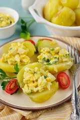 Boiled and fried potatoes stuffed with egg filling