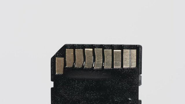 Melting black secure digital memory card.
Closeup video footage of plastic memory card being melted.