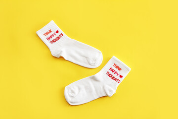 Antalya, Turkey, January 30, 2021. White sports cotton socks on a yellow background