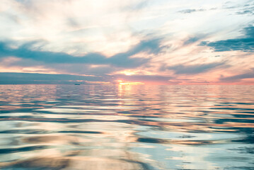 Sunset over still sea