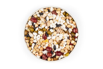 a handful of cereals in a round bowl on a white background