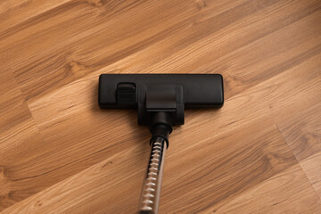 Cleaning the floor with a vacuum cleaner