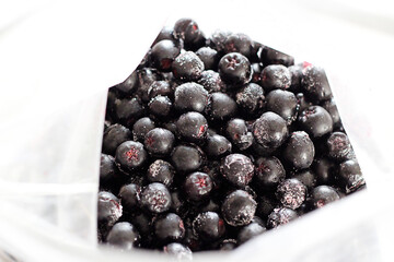 top view of frozen black berries in a package