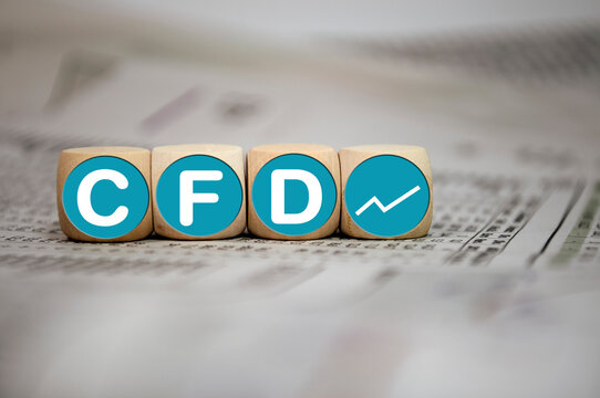 Cubes, dice or blocks with acronym CFD - Contracts For Difference on wooden background