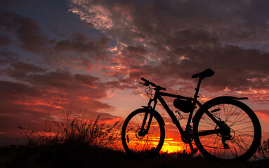 Fototapeta na wymiar bike in the background fire sunset.
