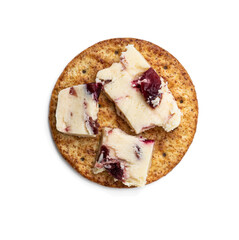 Cranberry cheddar cheese with wheat crackers isolated on white. Top view.