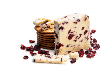 Cranberry cheddar cheese with wheat crackers isolated on white
