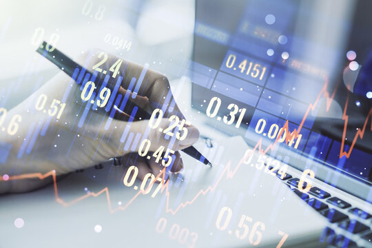 Abstract creative financial graph with hand writing in notebook on background, forex and investment concept. Multiexposure